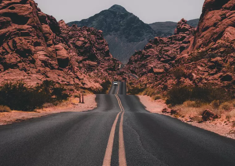 beautiful long road rolling through rocky desert