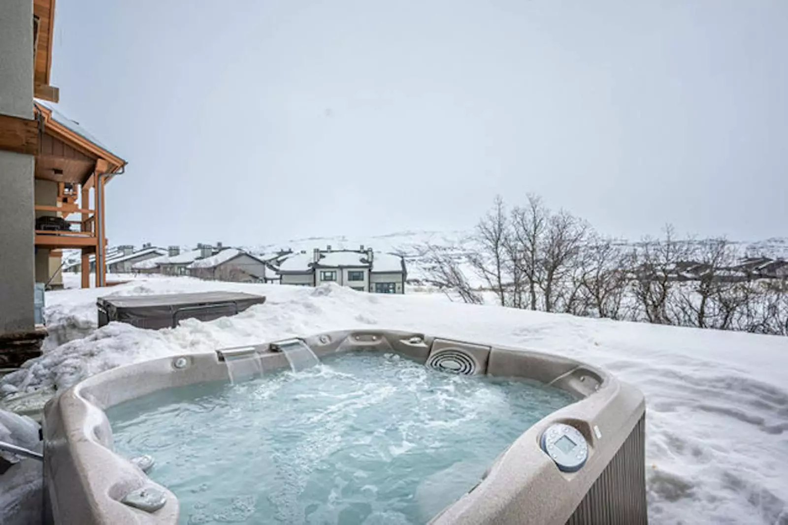 hot tub surrounded by snow