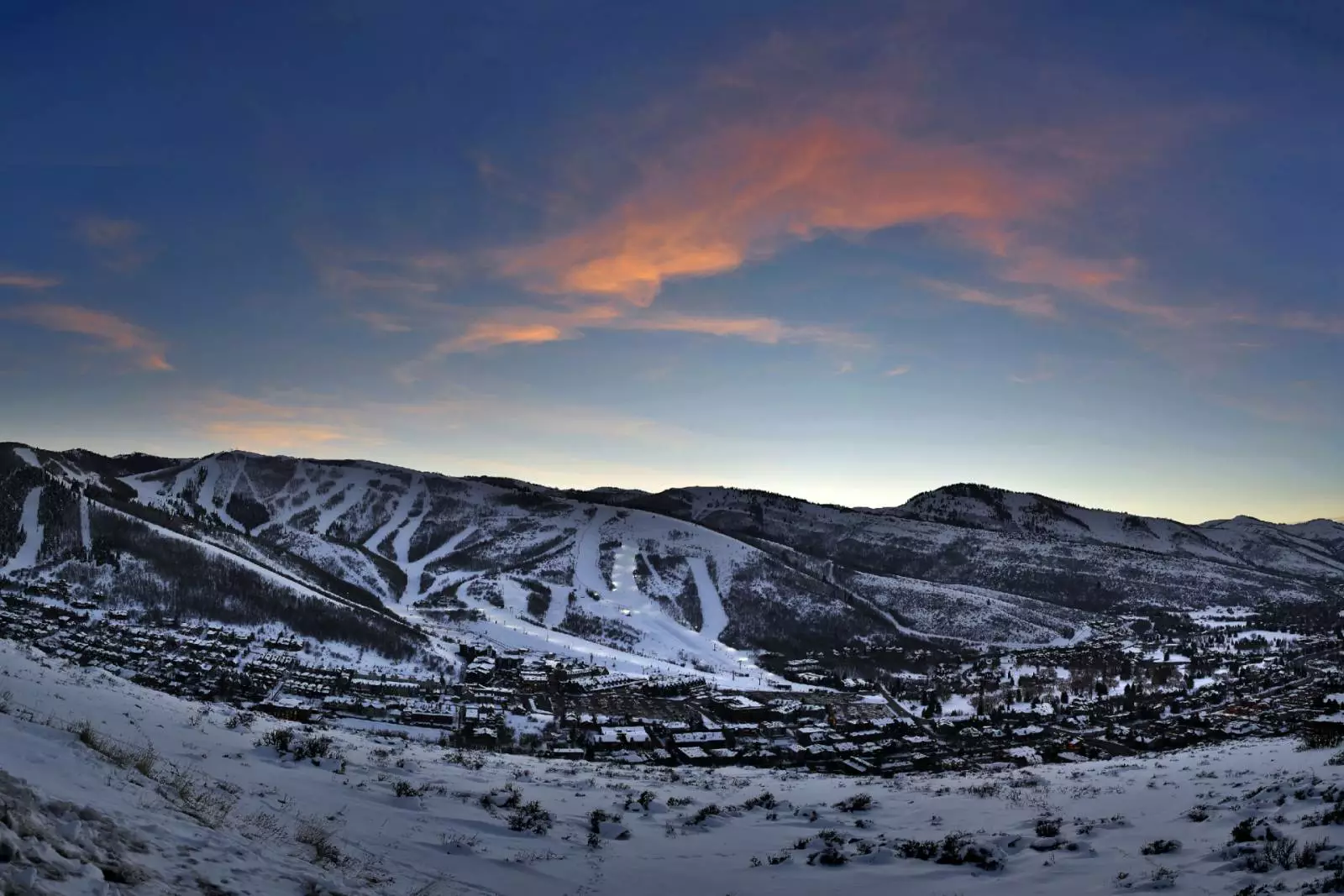 snow covered mountains at dusk