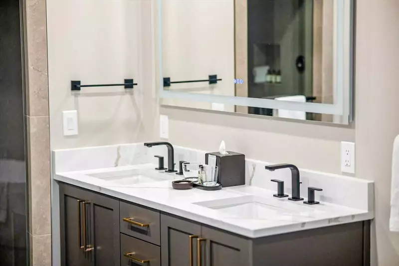 Designer Primary En Suite bathroom with double quartz vanity, LED backlit mirror, and steam shower. Upscale Westgate Park City lodging