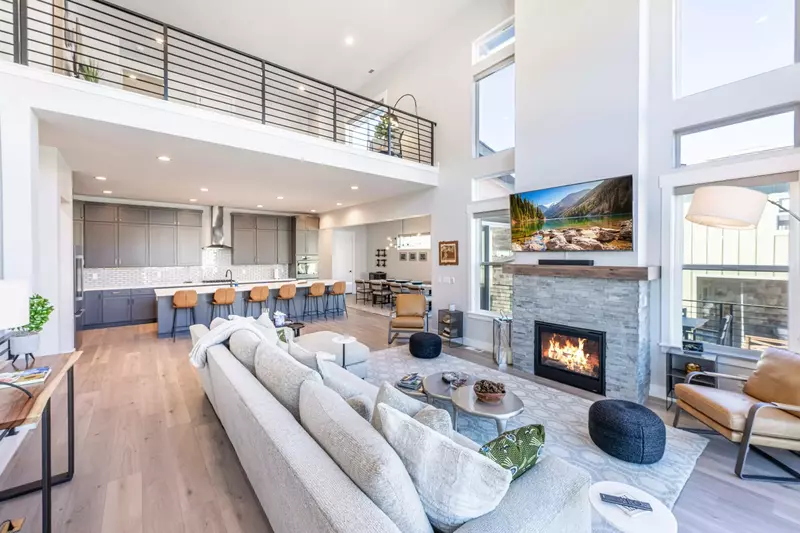 Stunning living room offers a warm gas fireplace and luxury seating for guests while they enjoy watching the large flat screen tv.