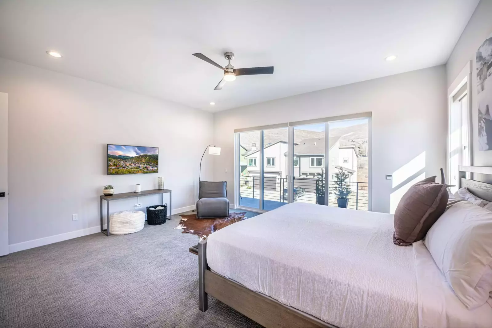 Enjoy your own tv in the primary suite of the home, there is also a comfortable space to sit and enjoy a book