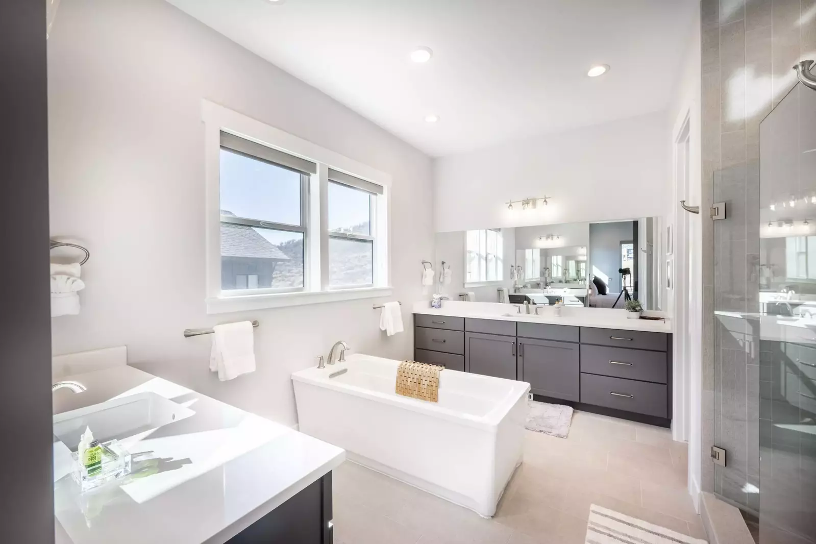 Relax in the luxurious primary ensuite oversized soaker tub which also offers 2 large sinks and vanities, and a walk in shower