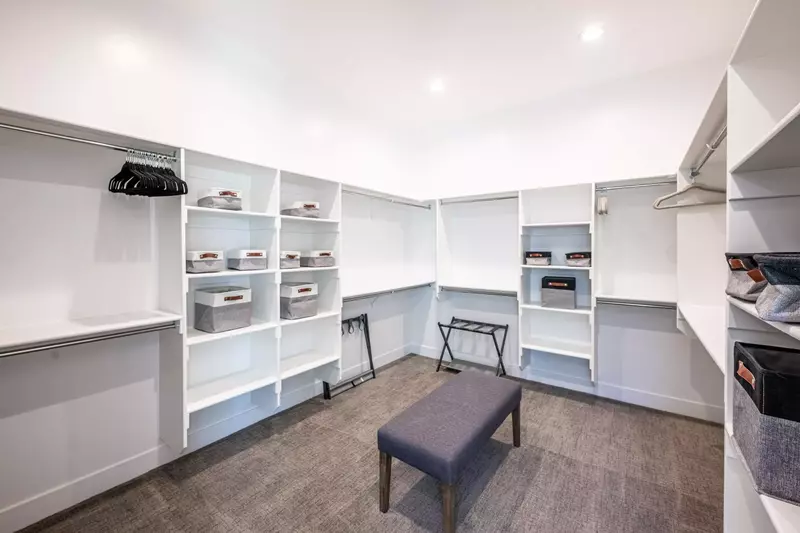 The primary bedroom has an oversized walk in closet available for guest use providing ample storage
