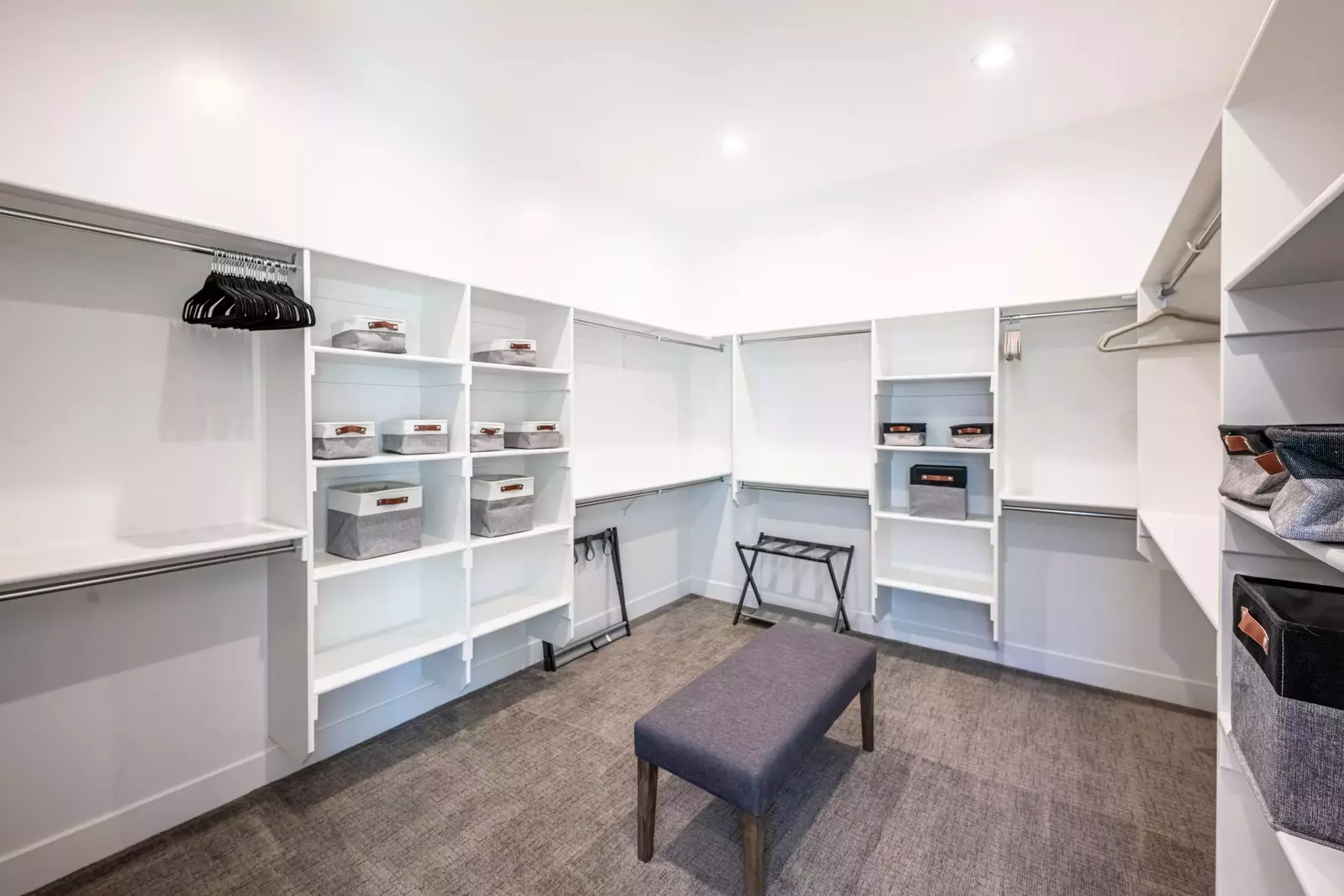 The primary bedroom has an oversized walk in closet available for guest use providing ample storage