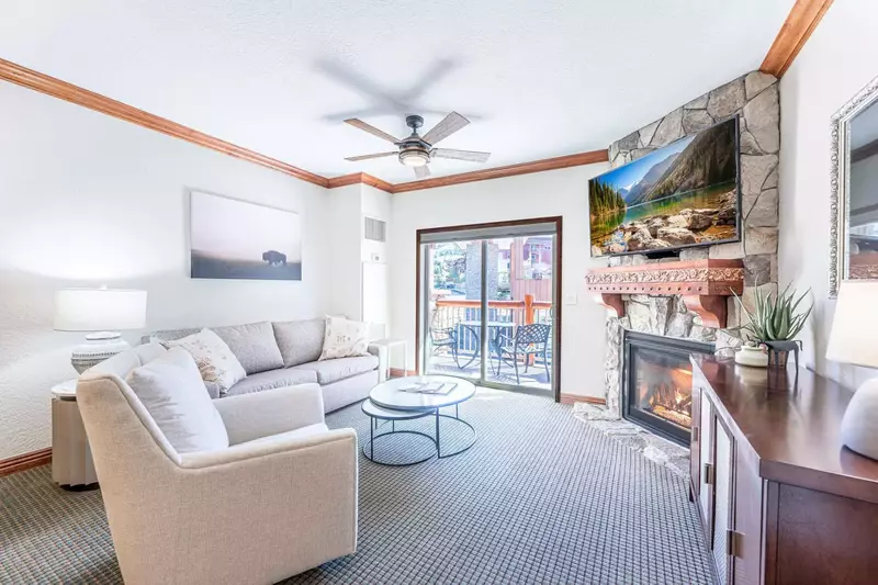 The living room is bathed in natural light, offering a generous and inviting space for relaxation.