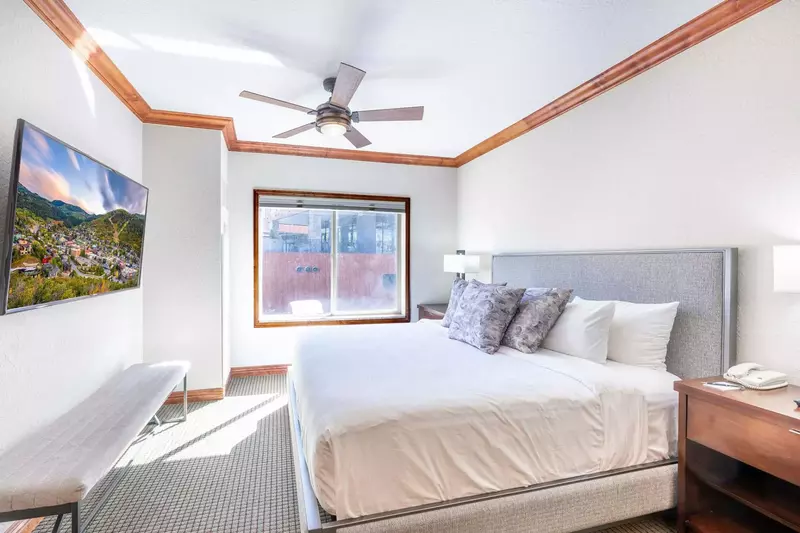 In the luxurious Primary Suite you'll find a beautiful king bed, two elegant nightstands, an HDTV for your entertainment and room darkening shades.