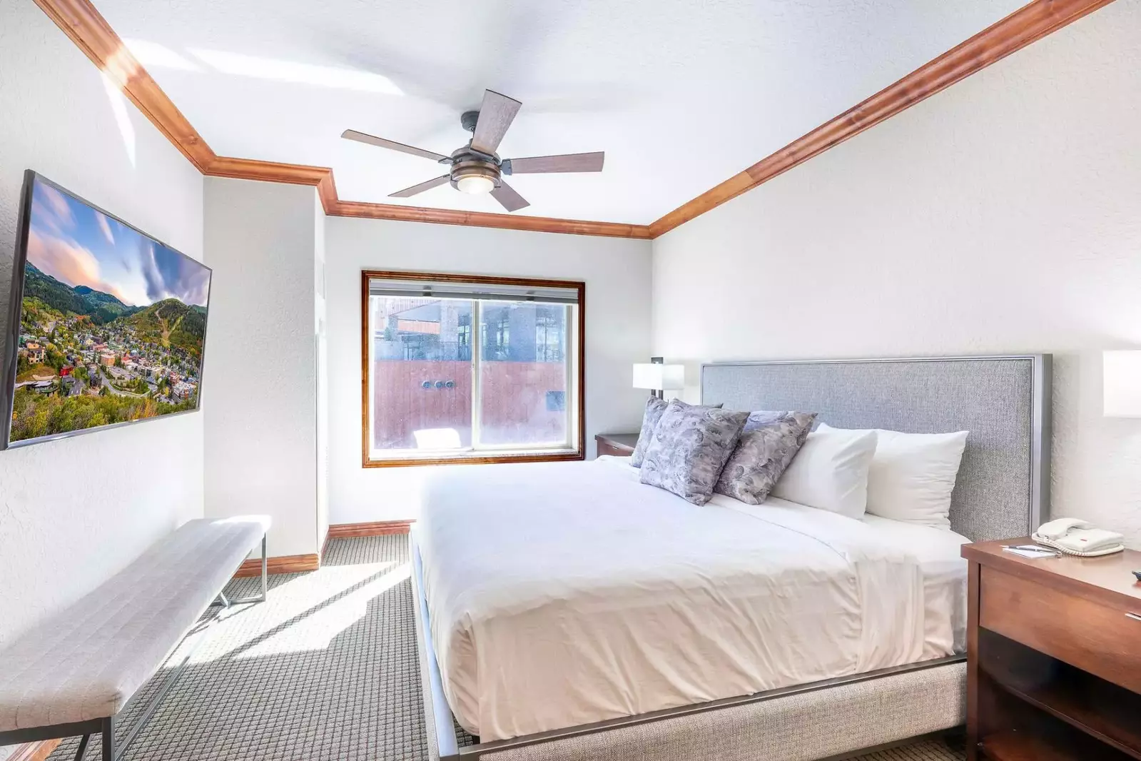 In the luxurious Primary Suite you'll find a beautiful king bed, two elegant nightstands, an HDTV for your entertainment and room darkening shades.