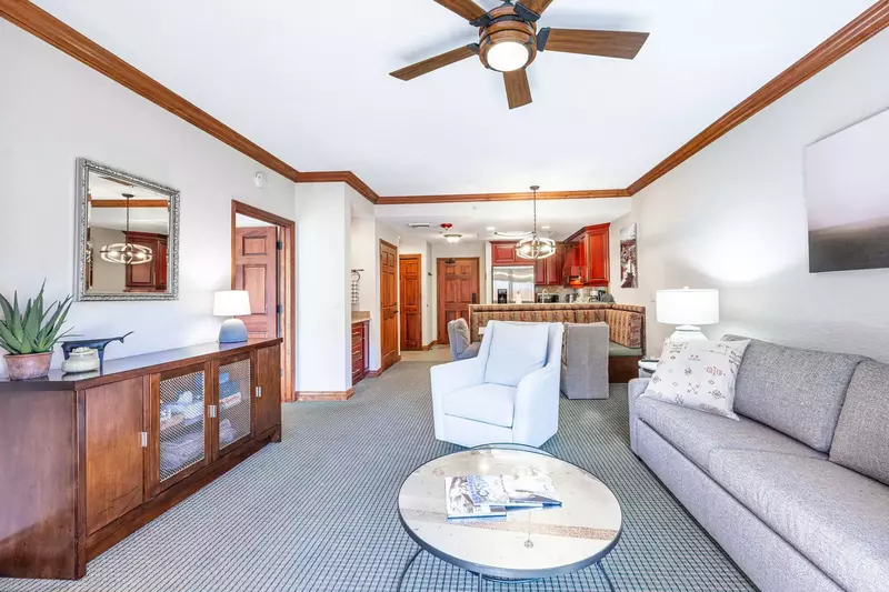 The lovely living room features a queen sleeper sofa, a cozy love seat, a charming gas fireplace, and an HDTV with Comcast for your entertainment.