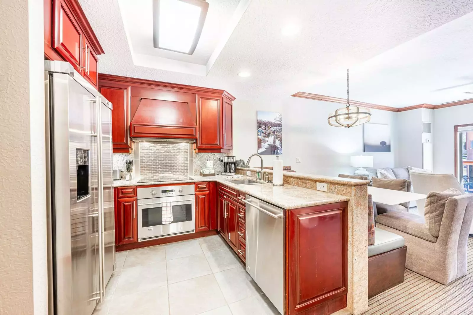 Inviting and spacious home with a bright and open floor plan. The fully stocked modern kitchen offers a wonderful view of the dining and living areas.