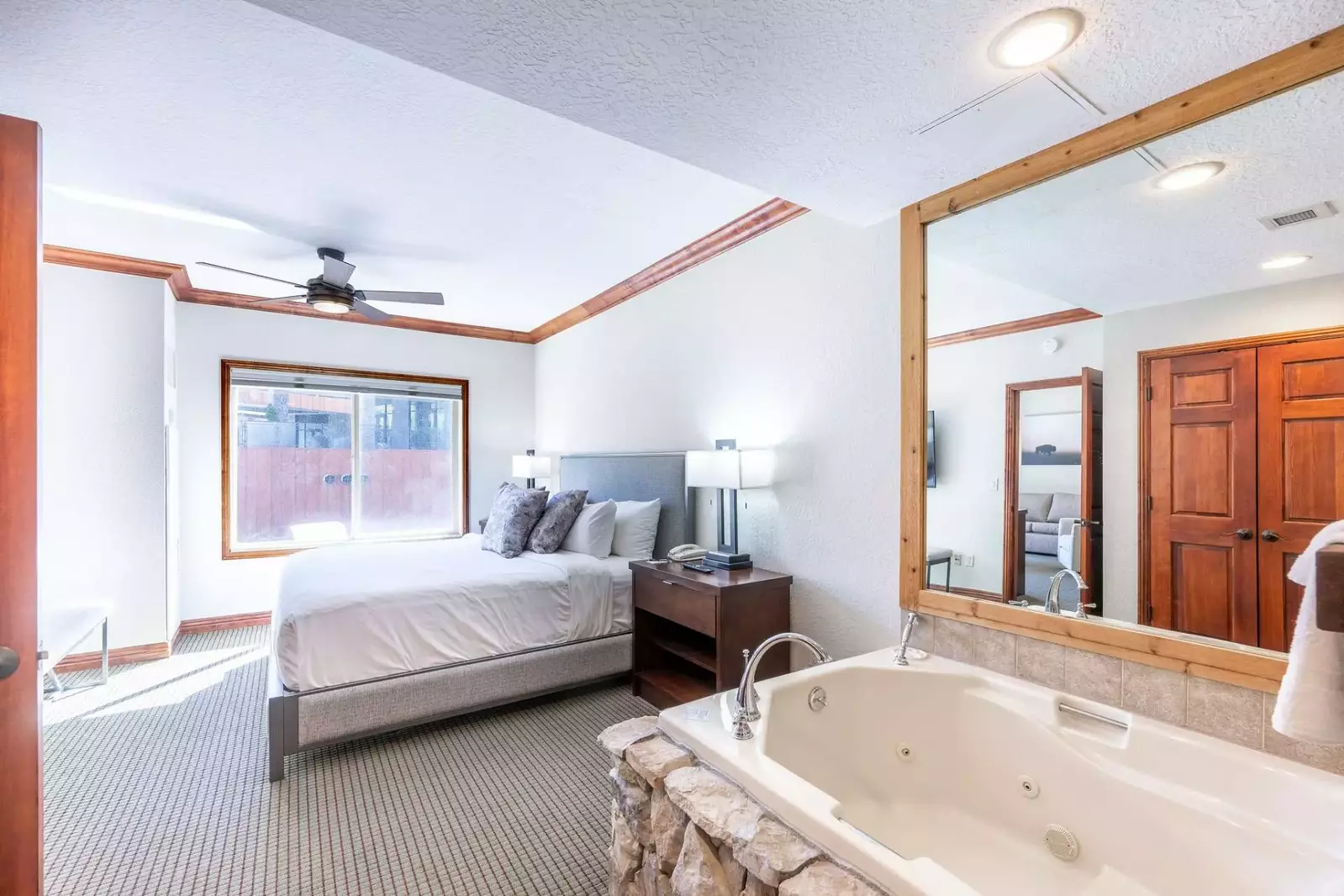 Unwind in the spacious en suite jetted tub, thoughtfully designed separate from the bathroom to accommodate the leisurely preparations of two guests