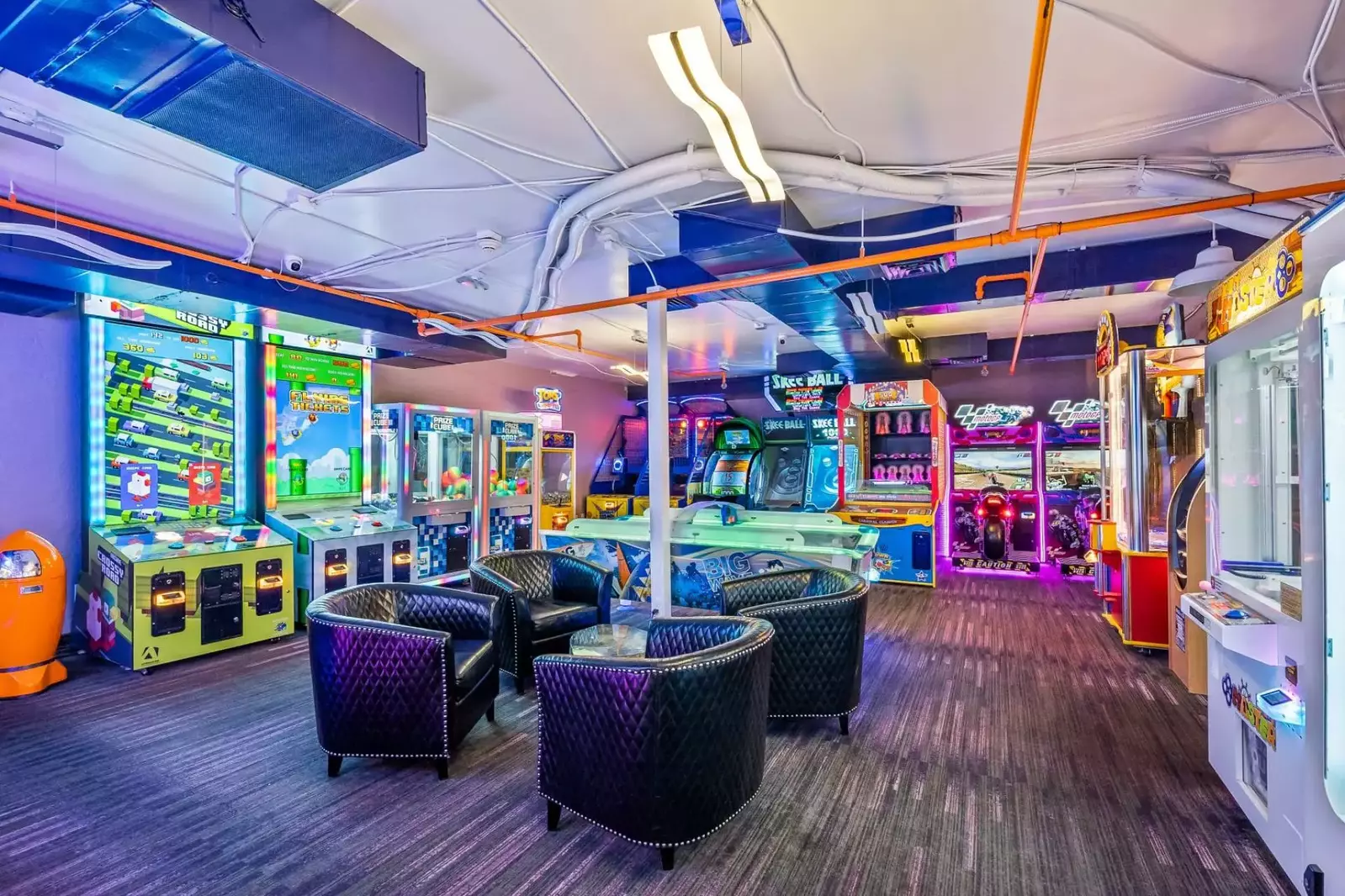 Welcome to the spacious arcade, where kids can have a blast playing a variety of exciting video games. It's the perfect place for some family fun!