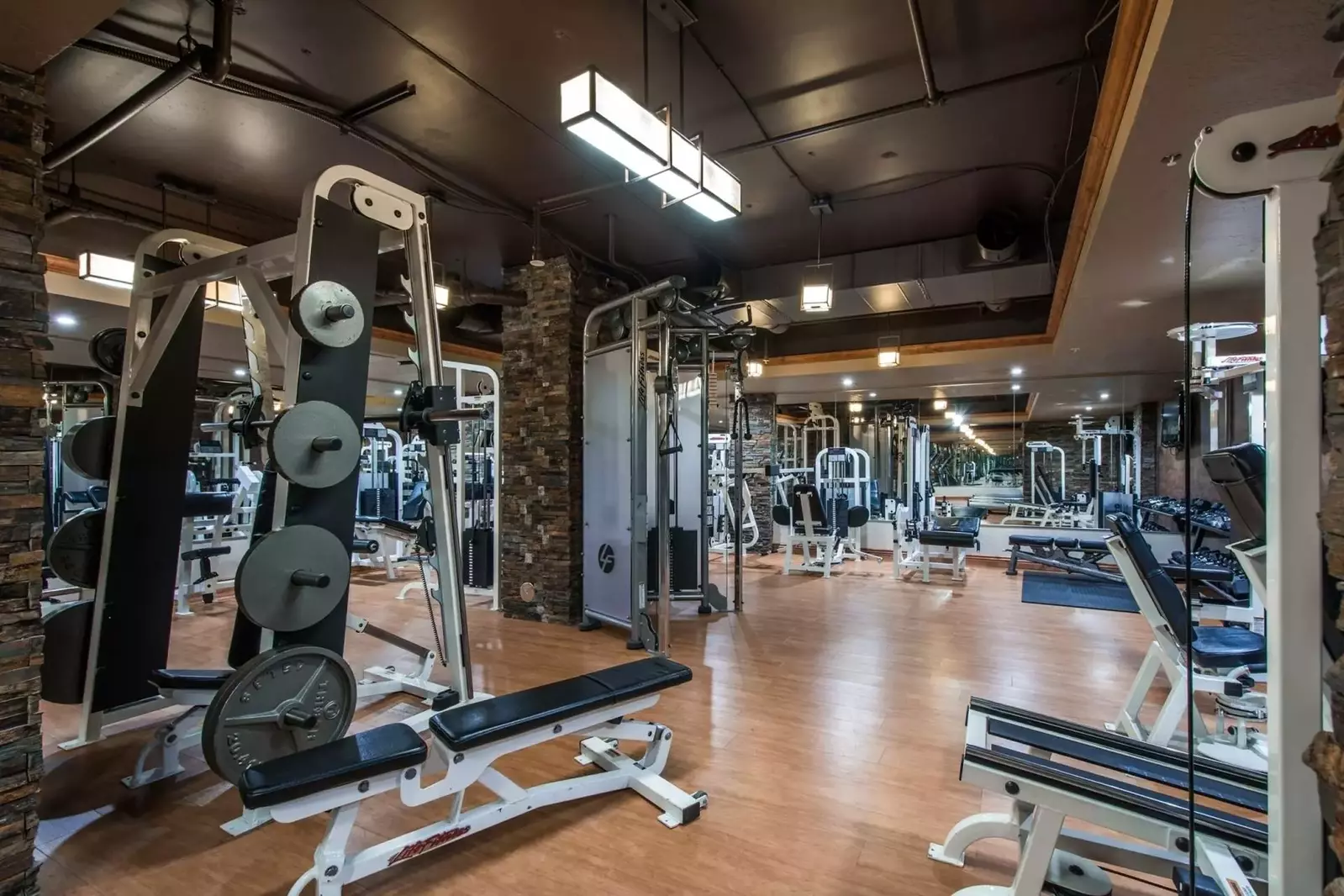 A modern fitness center equipped with state-of-the-art equipment and expert trainers, perfect for staying fit and active during your stay at our Westg
