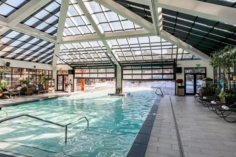 Welcome to Utah's largest indoor-outdoor pool, a delightful oasis available all year round. Dive into the crystal-clear waters and bask in the perfect