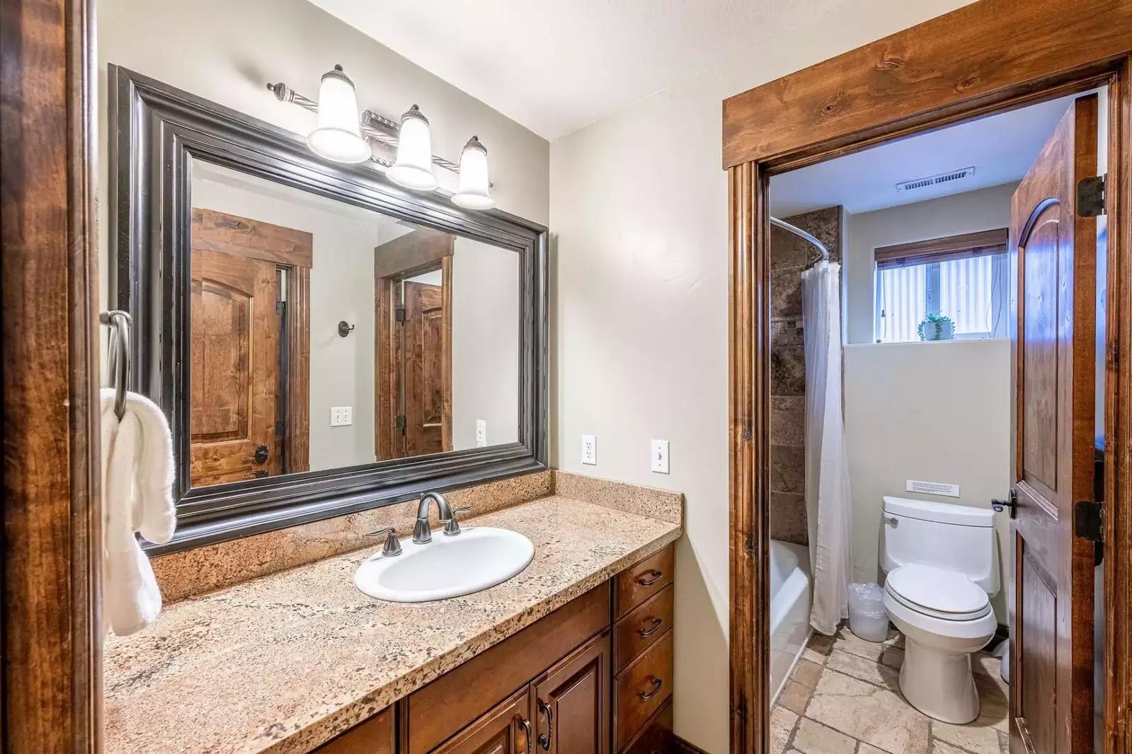 Located on the lower level and ideal for families, this en suite / jack and jill bathroom is perfect for those who want to lock off for privacy or lea