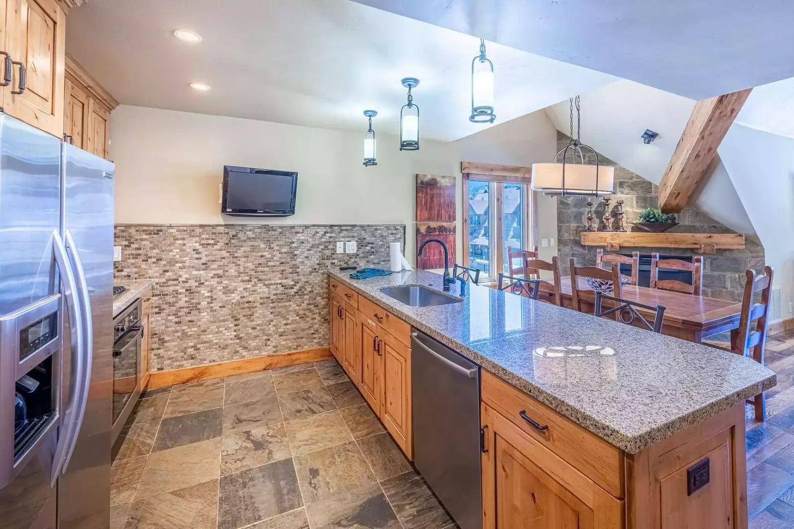 This unique kitchen features a tv with Xfinity so you don't miss a minute of your favorite show while preparing an eat in meal.
