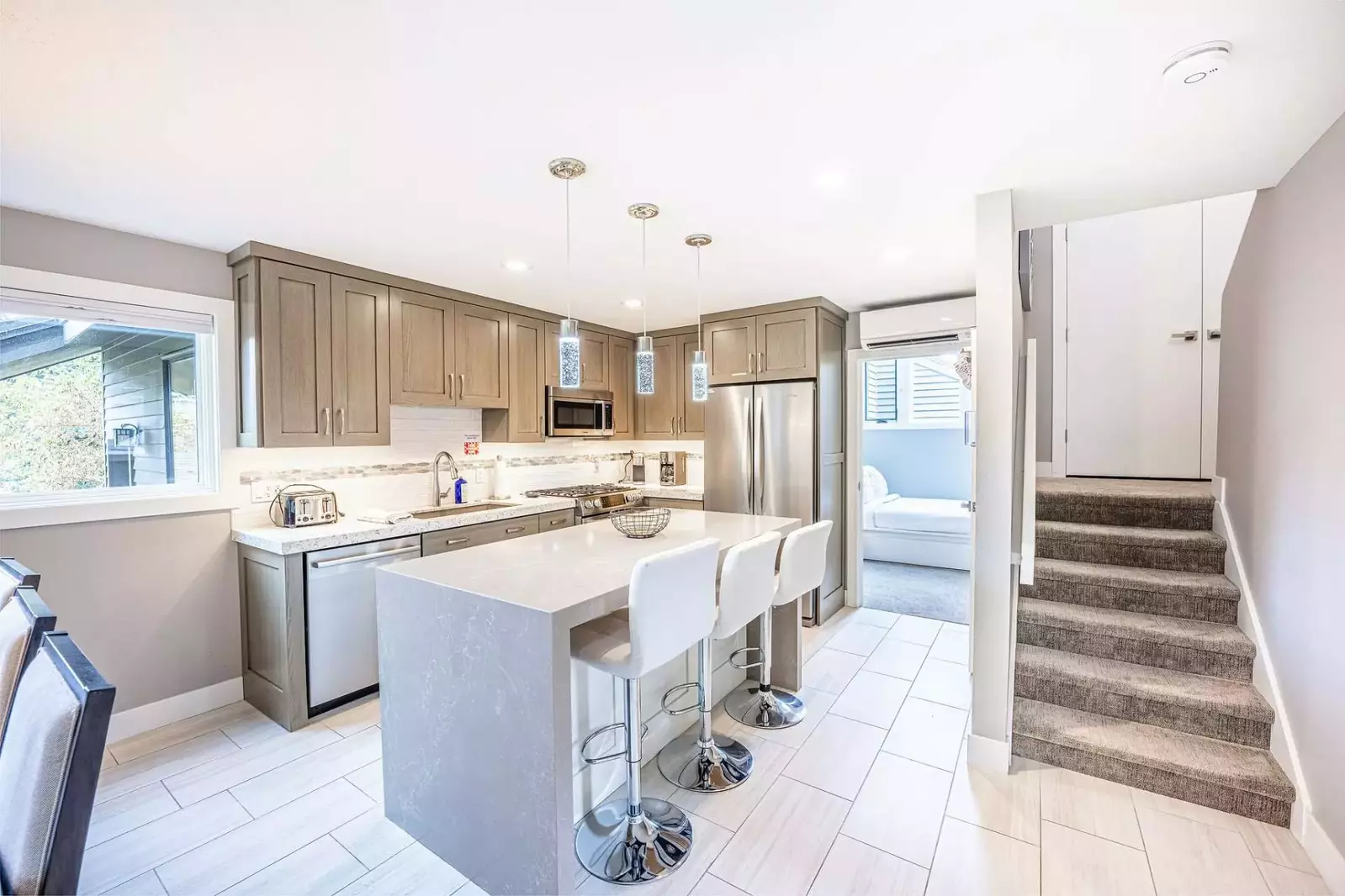 The Fully Stocked, Gourmet Kitchen Features High End Bosch Appliances, Breakfast Bar w Waterfall Edge, Under Cabinet Lighting, Keurig Coffee Maker, Ga