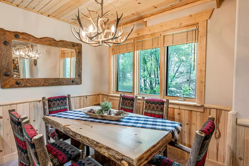 The dining room table is just off the kitchen and has comfortable seating for 6 guests.