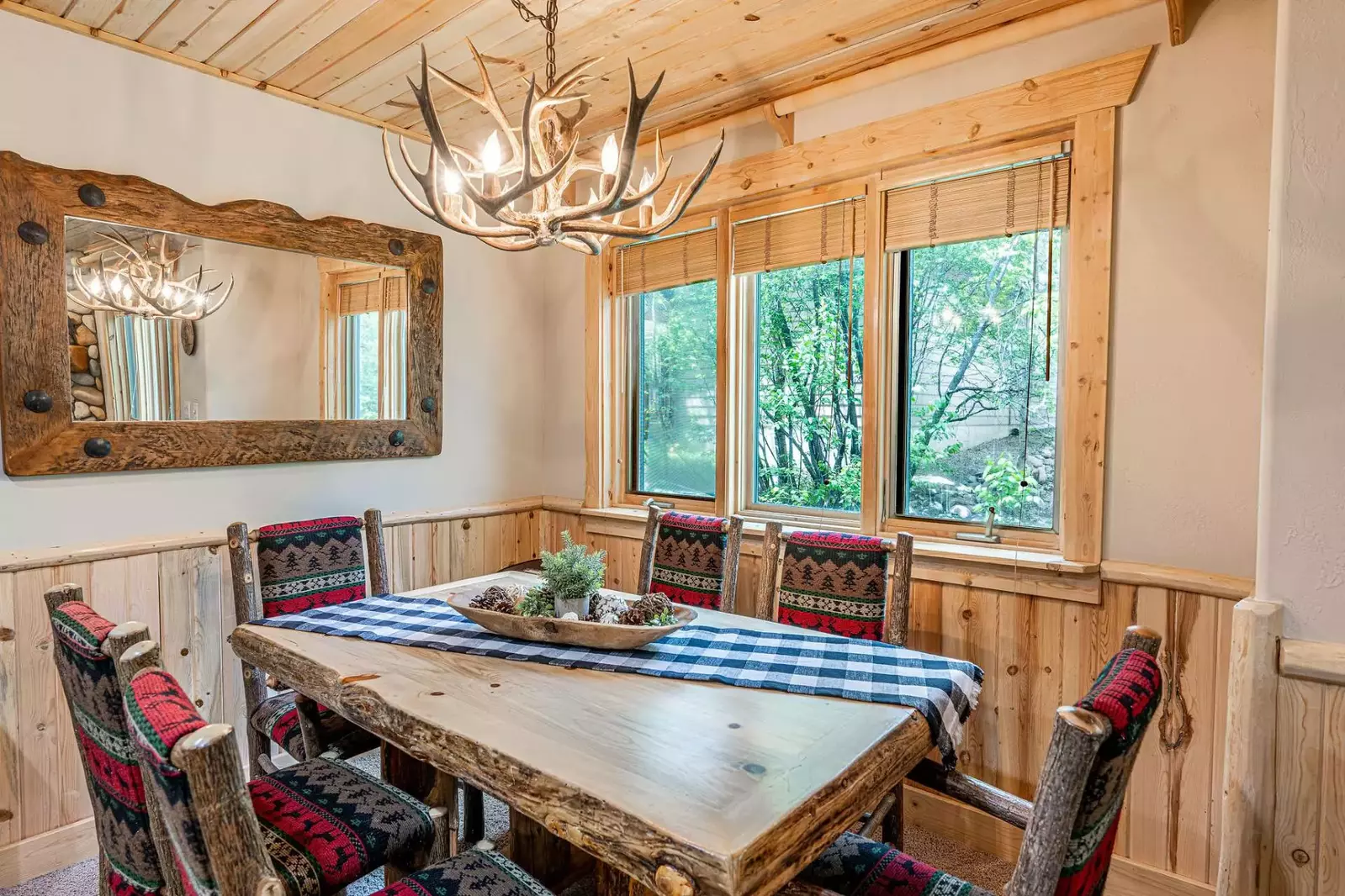 The dining room table is just off the kitchen and has comfortable seating for 6 guests.