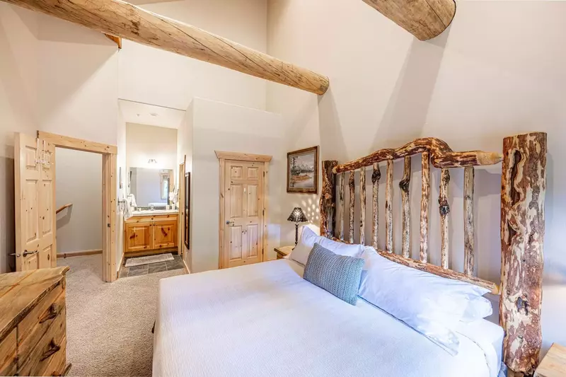 The primary bedroom located just upstairs has a private attached bathroom and a king sized bed