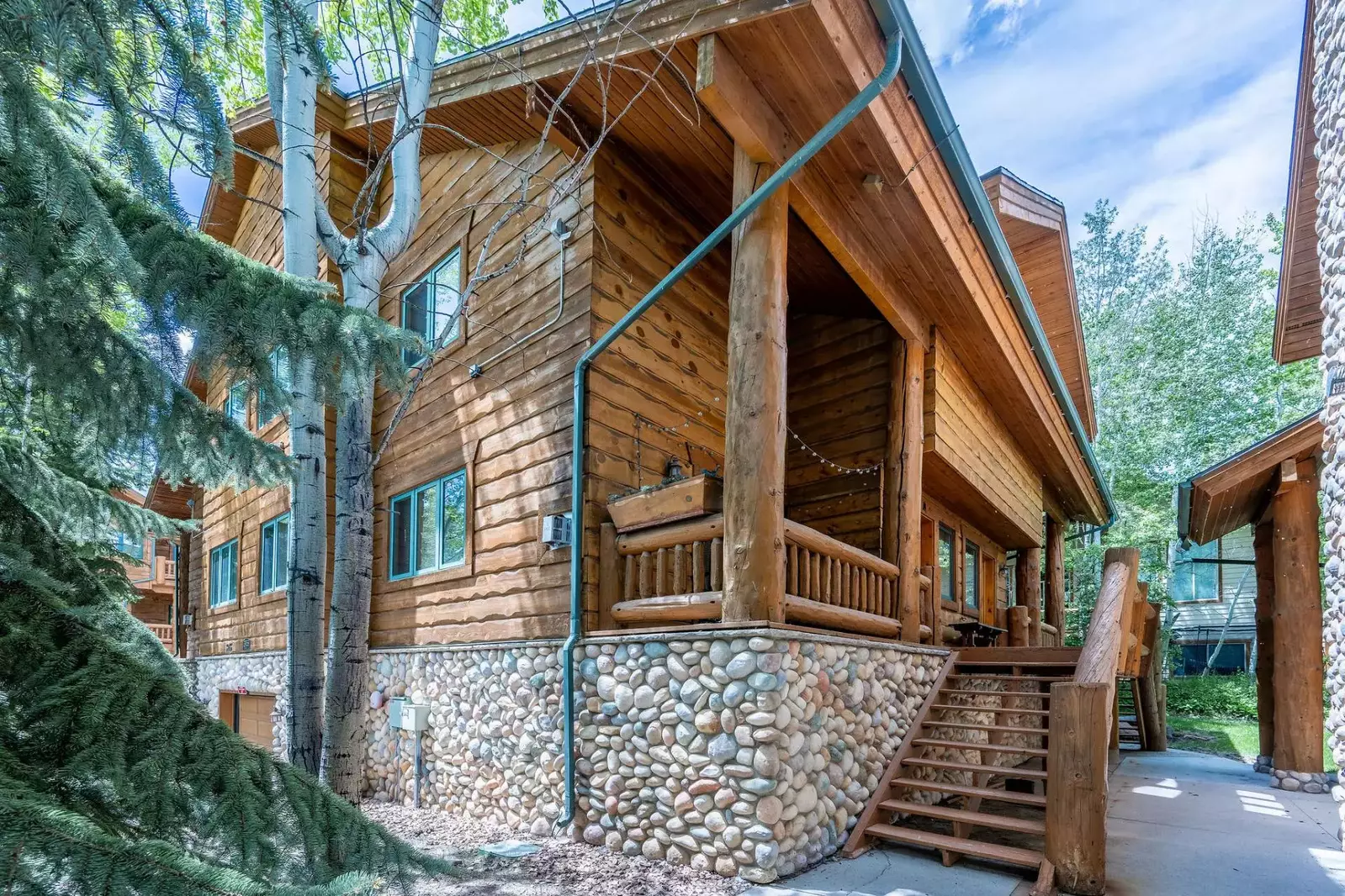 The steps leading up to the home in this beautiful mountain setting
