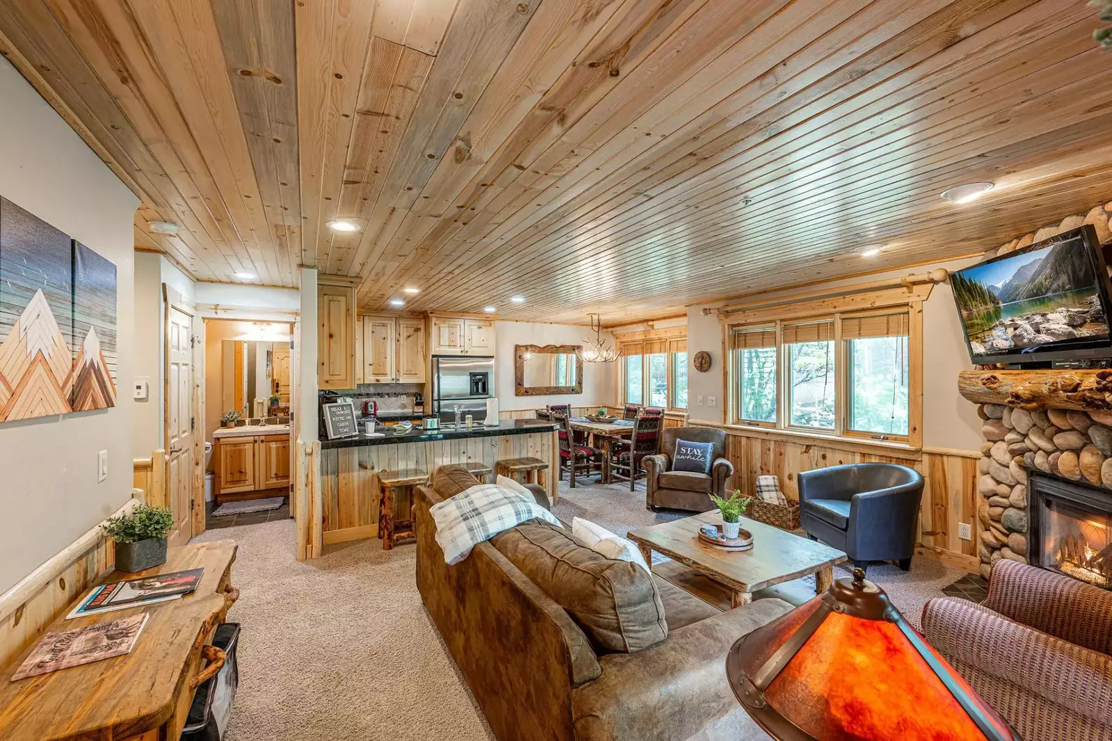 The main living are of the home features a fully equipped kitchen, dining room with dining table, and relaxing living room, perfect for entertaining