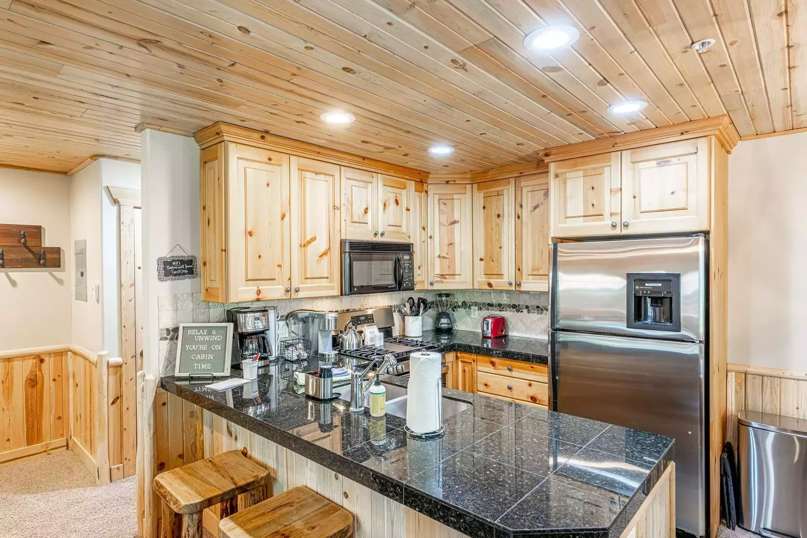 The kitchen is fully stocked with everytyhing you need to cook at home and a breakfast bar with seating for 3 guests