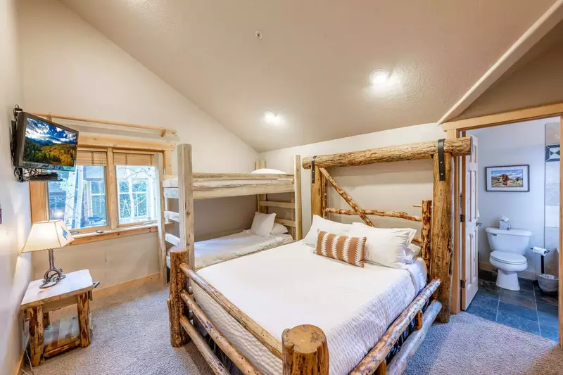 The guest suite features an en suite bathroom, a bunk bed with 2 twin beds, and a full sized bed, perfect for 4 guests