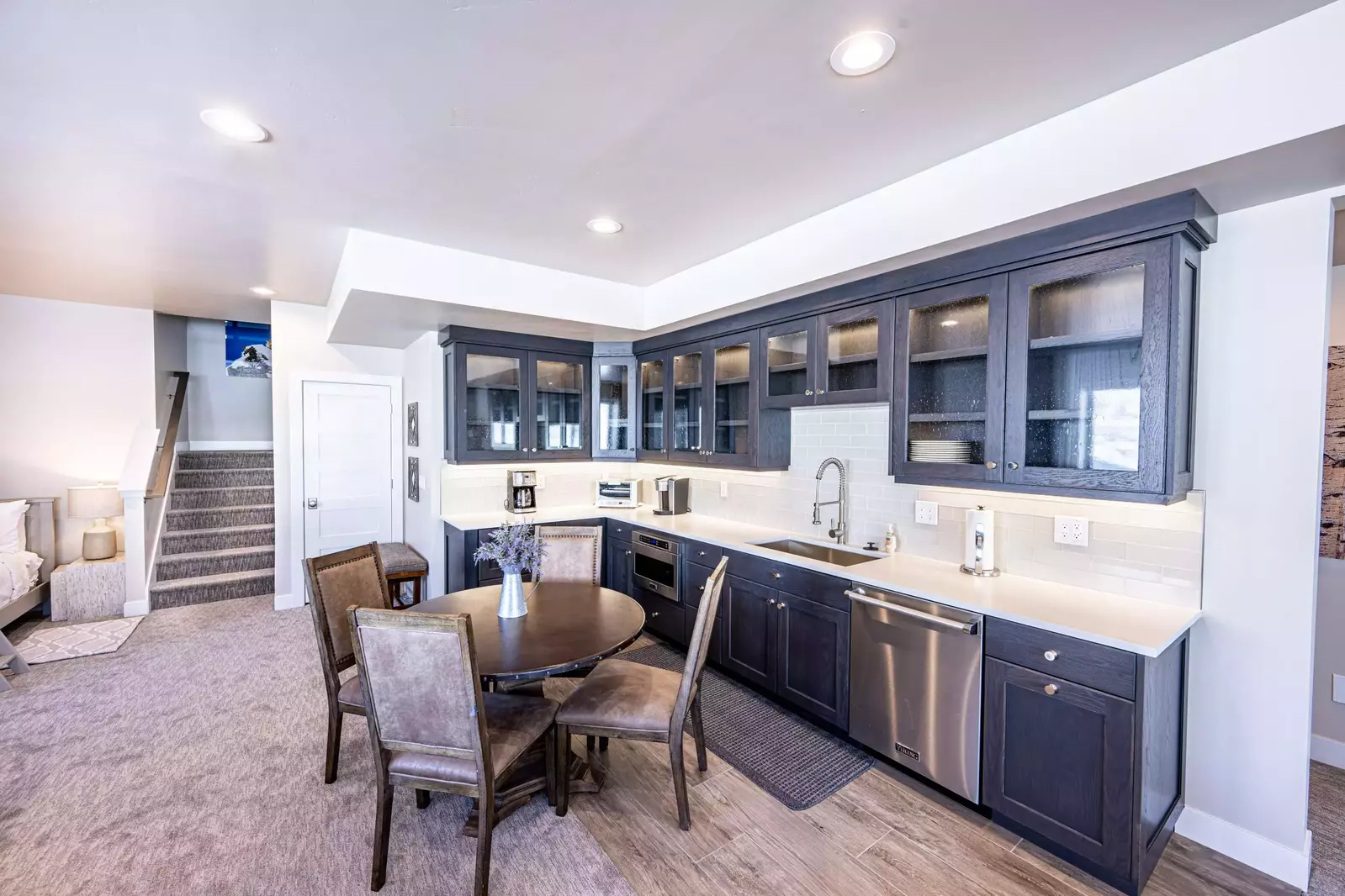 The lounge level offers a full kitchenette including a dining table - Perfect spot for game night!