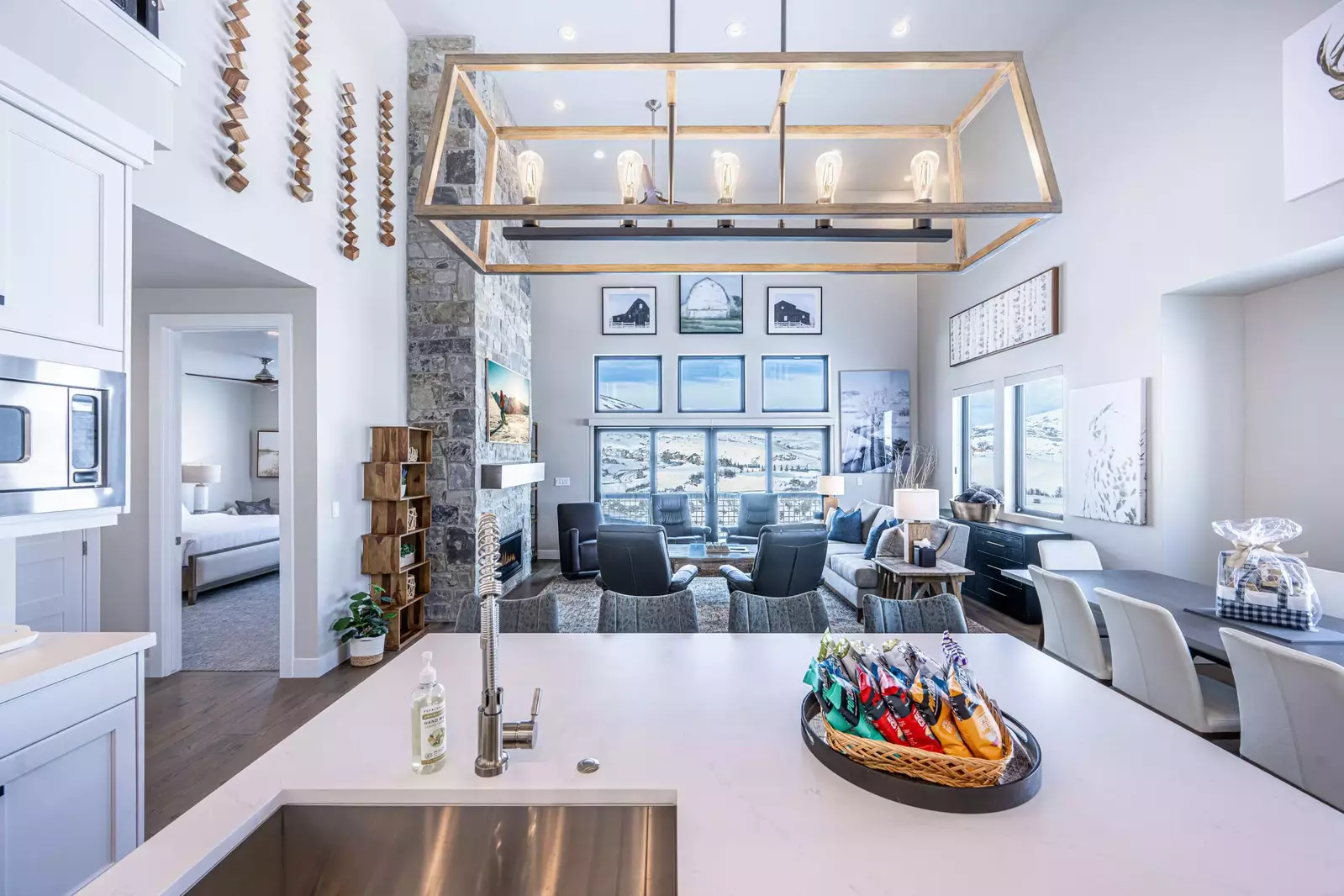 Open space living area infused with morning sunlight and views of the mountains