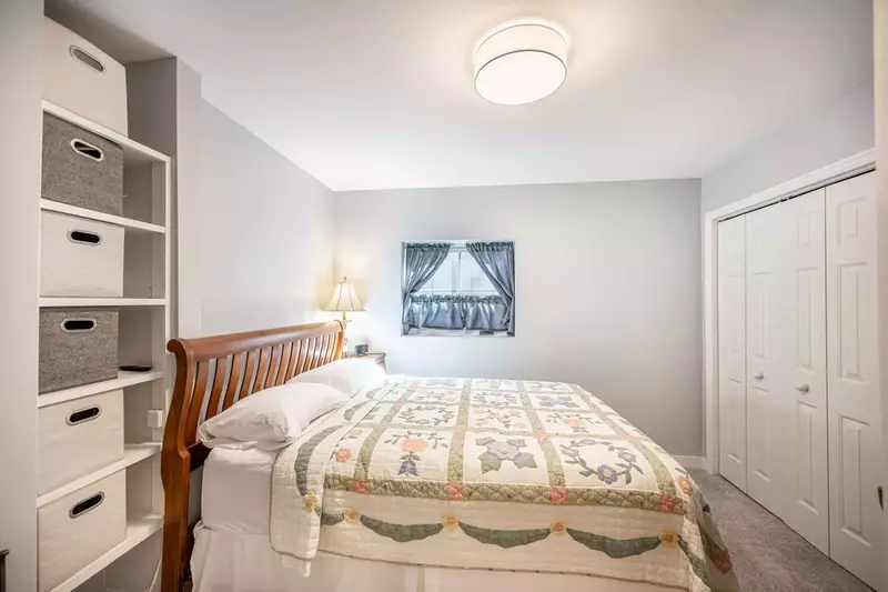 Located on the middle floor is the first guest suite featuring a comfortable queen bed and plenty of closet space!