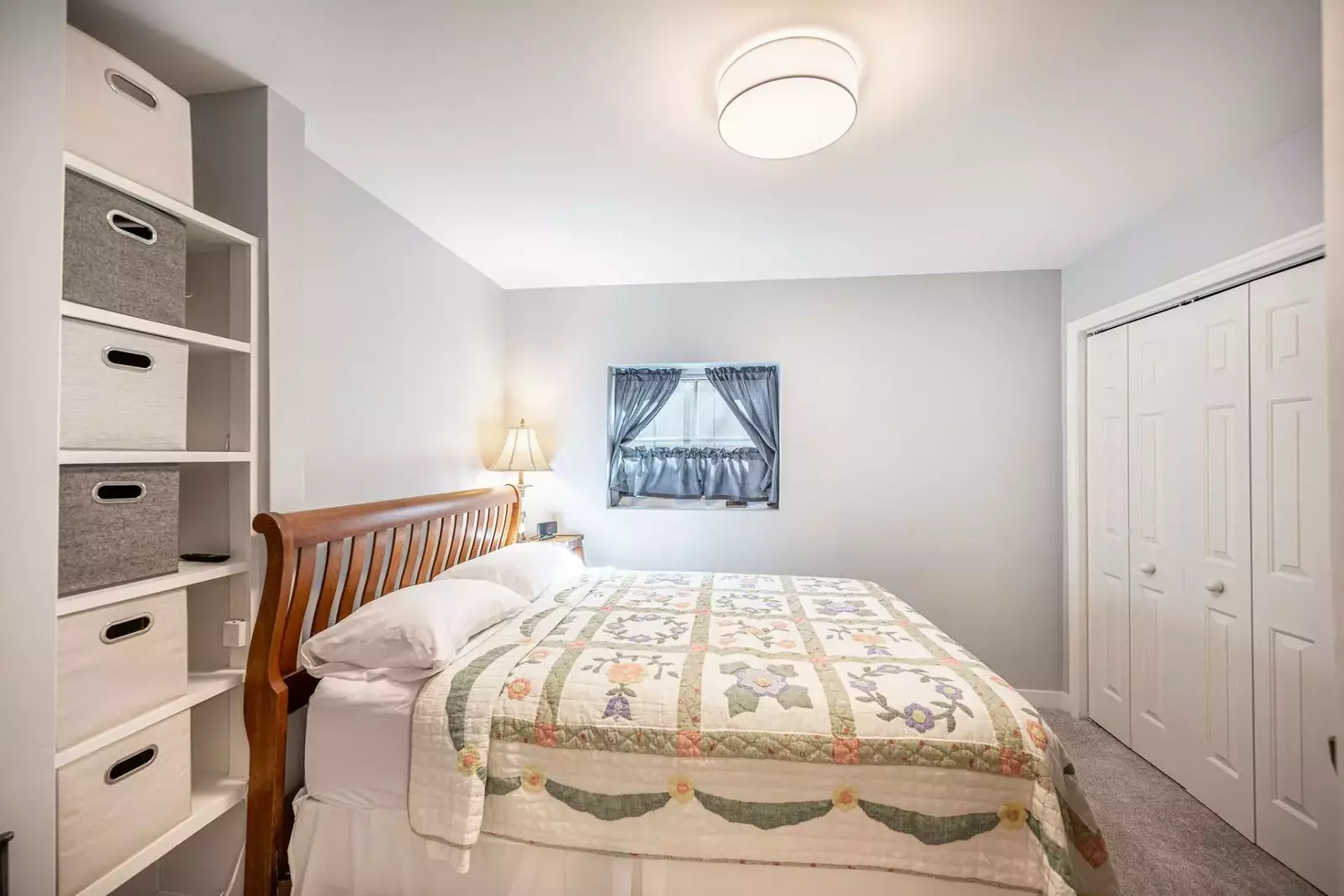 Located on the middle floor is the first guest suite featuring a comfortable queen bed and plenty of closet space!