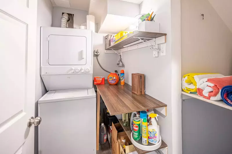 Perfect for longer stays - a stacked private washer and dryer are located next to the guest suite