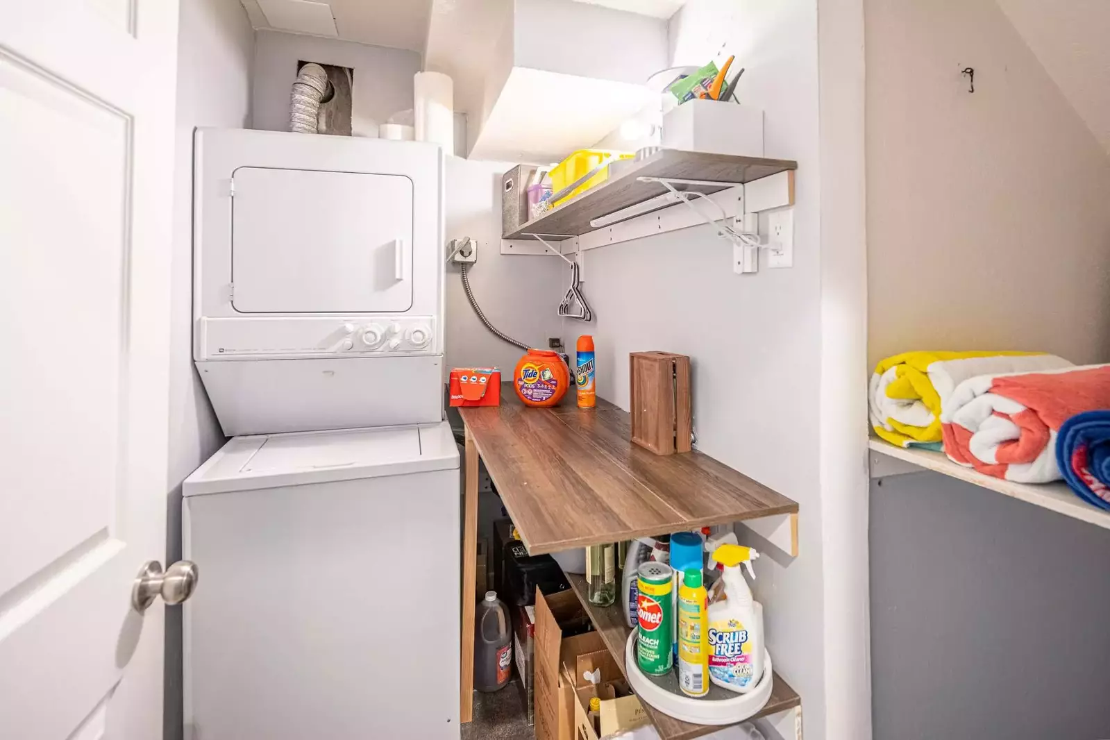 Perfect for longer stays - a stacked private washer and dryer are located next to the guest suite