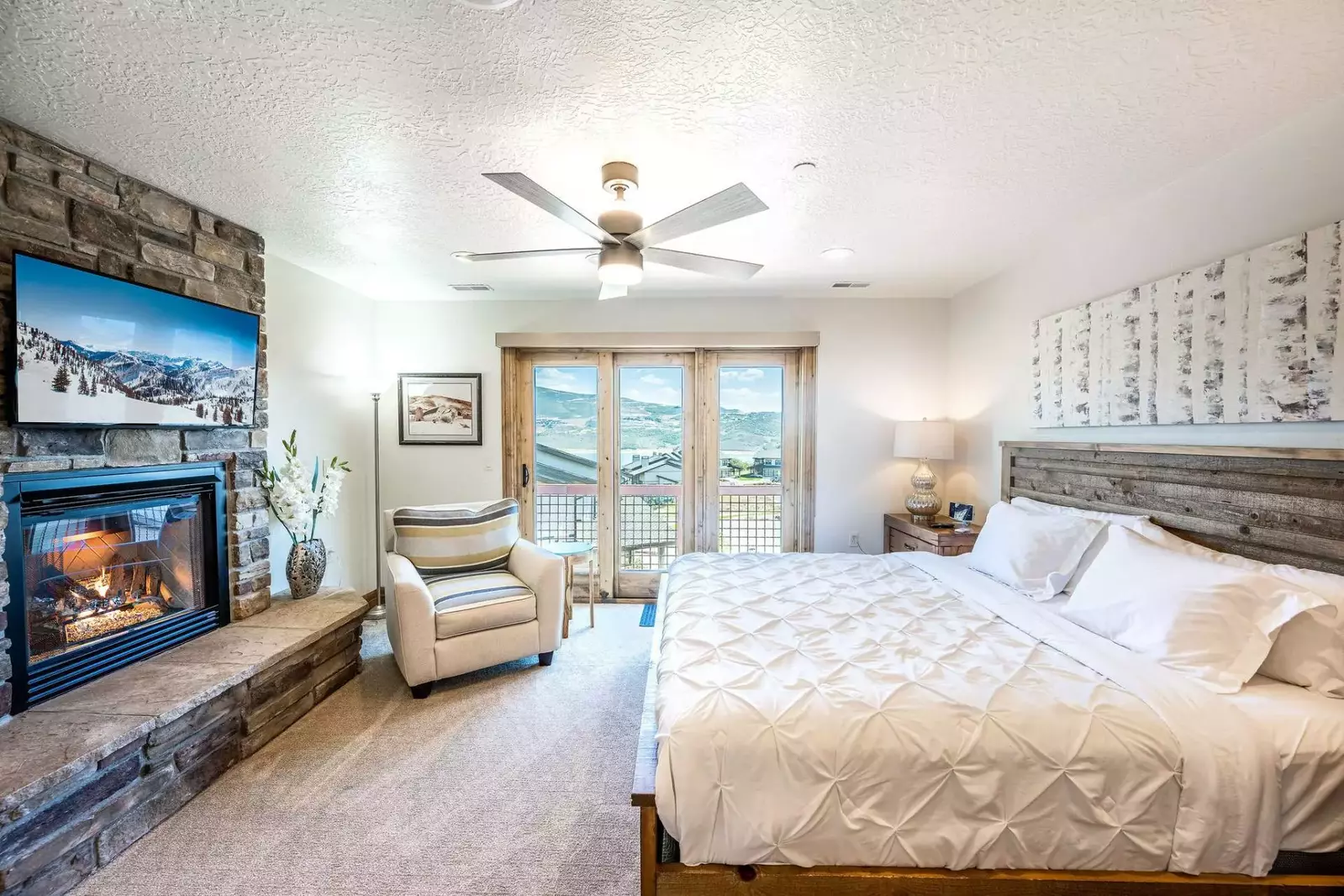 King bed with cozy fireplace and HDTV