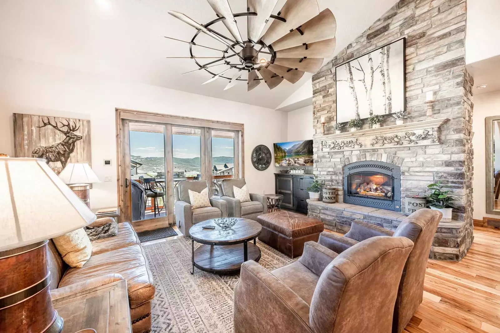 Cozy living room with plenty of comfortable seating, gas fireplace and HDTV