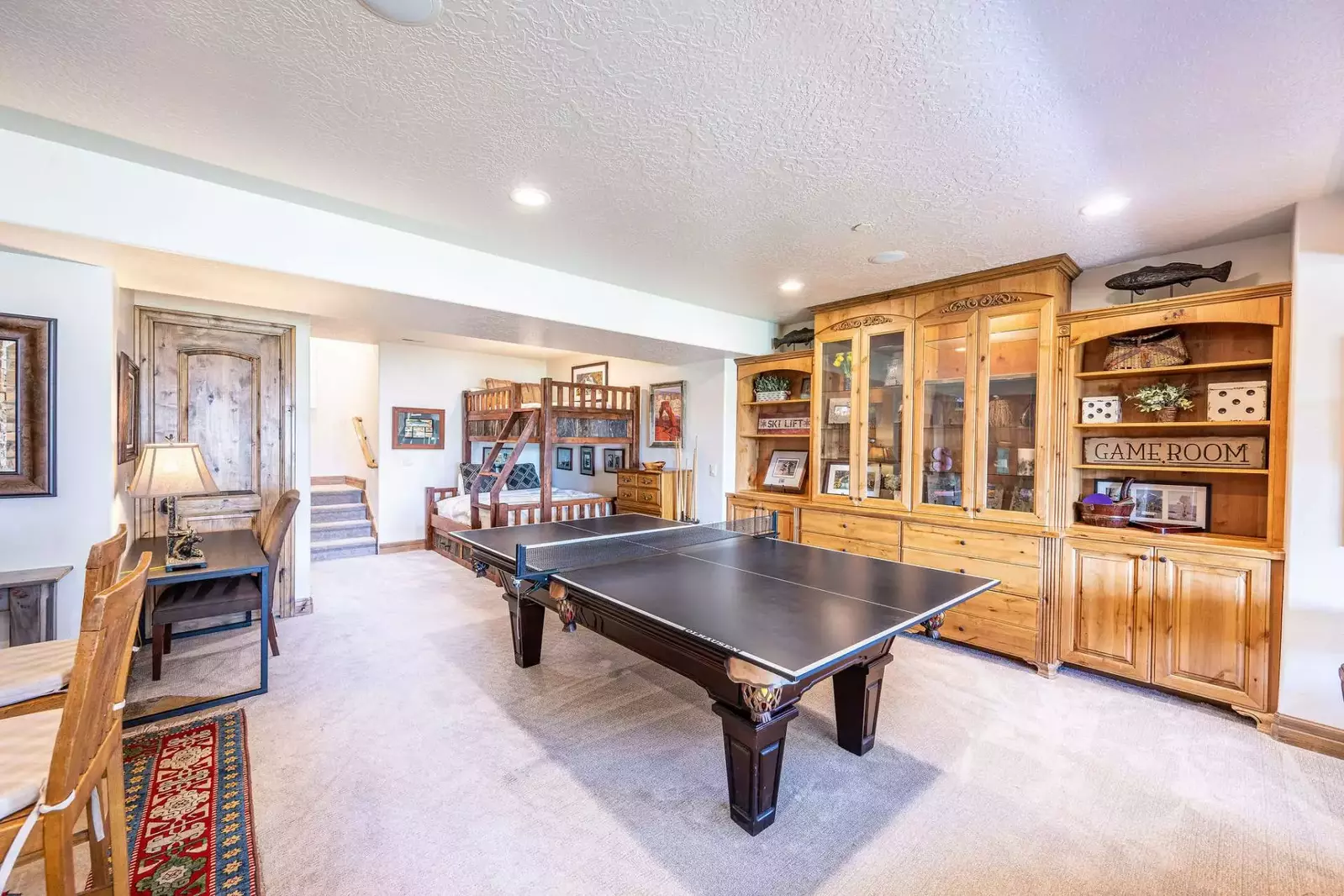Game Room with a Portable Table Tennis over the Pool Table