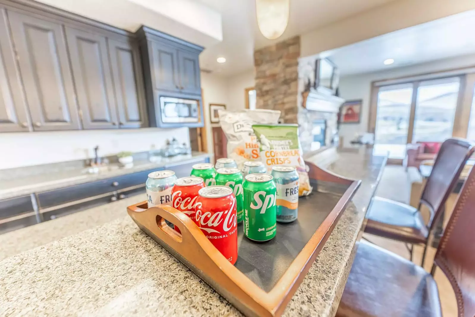 The lower level features a game table, video game console and a kitchenette - Perfect for game nights!