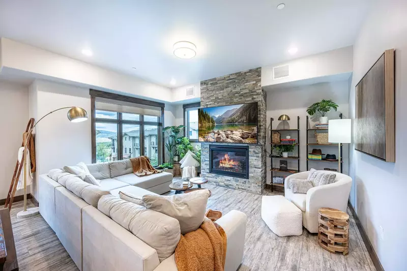 Spacious living room with oversized couch and gas fireplace