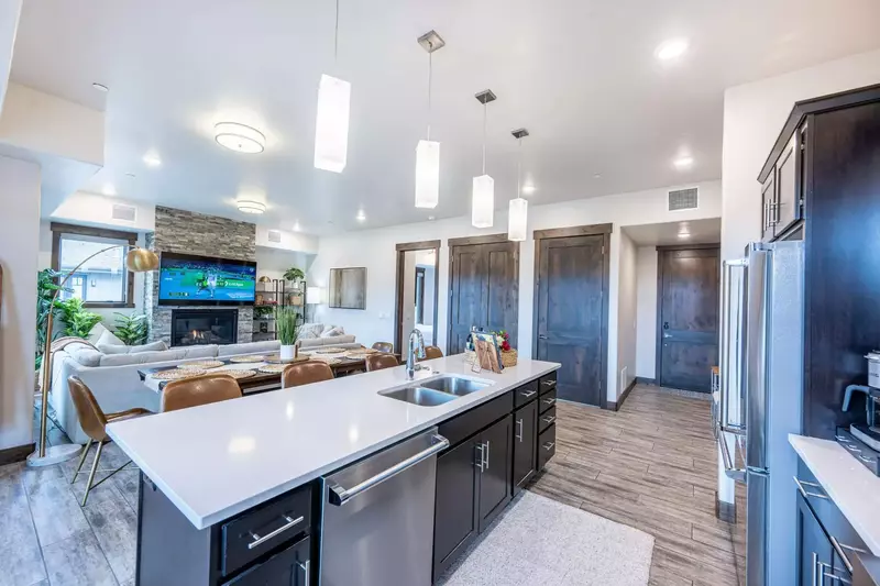 Plenty of space for cooking on this oversized quartz top island with a large dishwasher