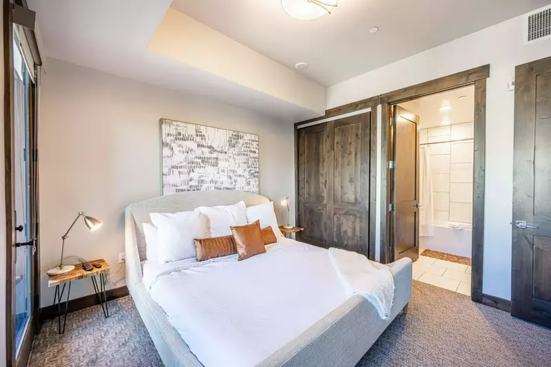 Guest Suite features a brand new king sized bed and en suite bathroom, full sized closet, fireplace, and private balcony