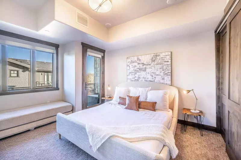 Private bedroom with a new king sized bed and new queen sized daybed, features a private balcony and en suite bathroom