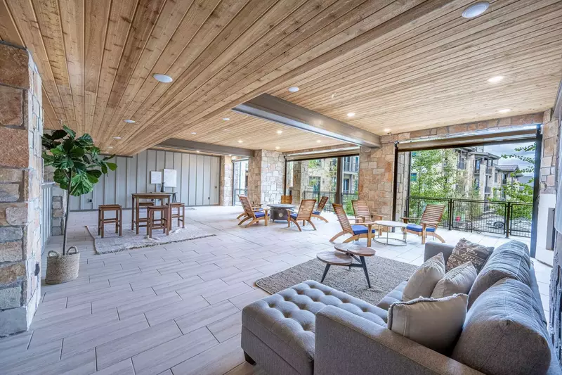 Communal space with outdoor patio furniture and large fire pit