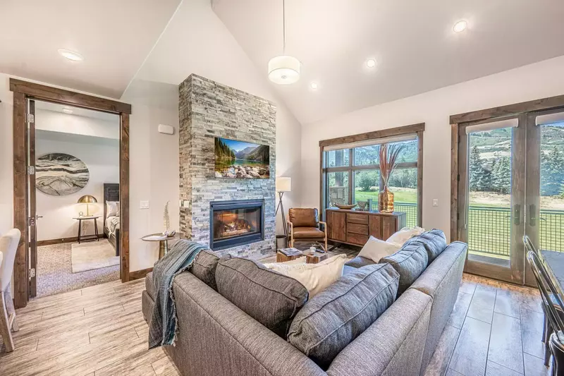 Massive windows throughout the main living area allow the outside in and welcome visitors with remarkable views of one of the most beautiful locations