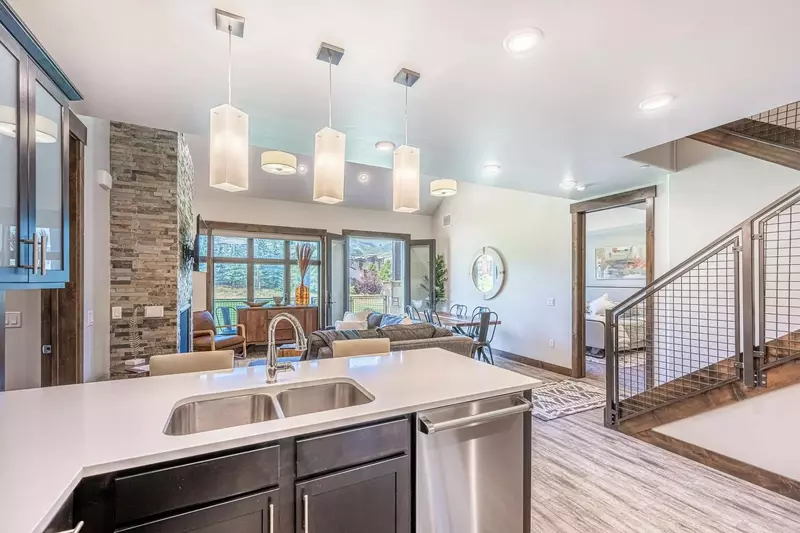 The perfectly appointed kitchen boasts top of the line Viking appliances, striking quartz countertops and an abundance of prep space for entertaining.