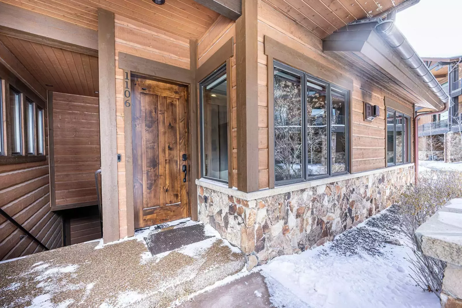 The front door of the home has easy access to the street that leads to the heated pool, fitness center, and more