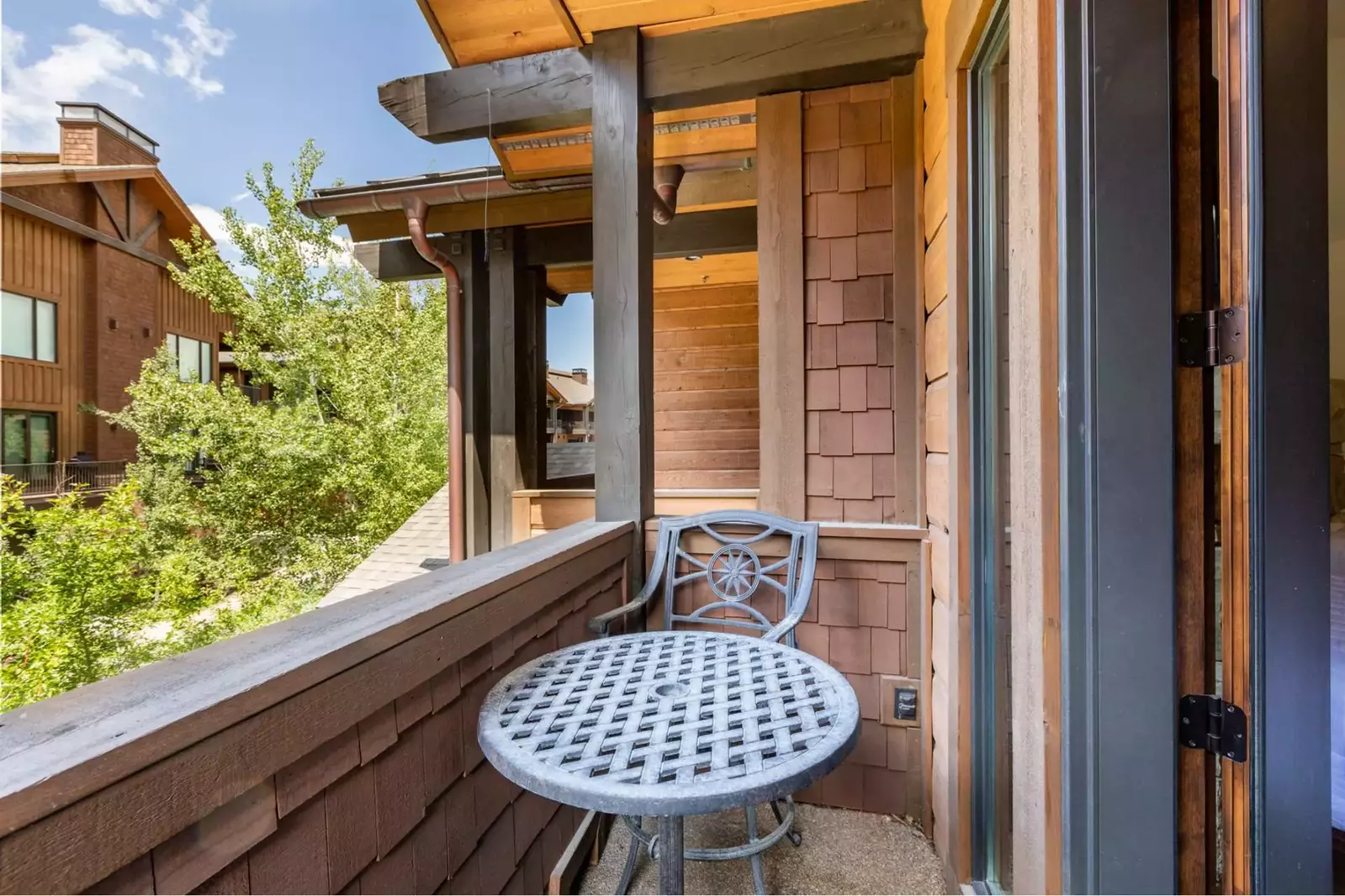 The guest suite also features a private balcony with a table and chairs to enjoy a cup of coffee while watching the sunrise.