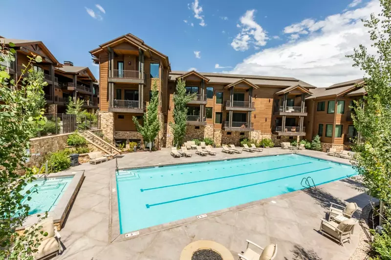This spacious outdoor hot tub is steps away from the front door of this home and located beside the Olympic sized pool