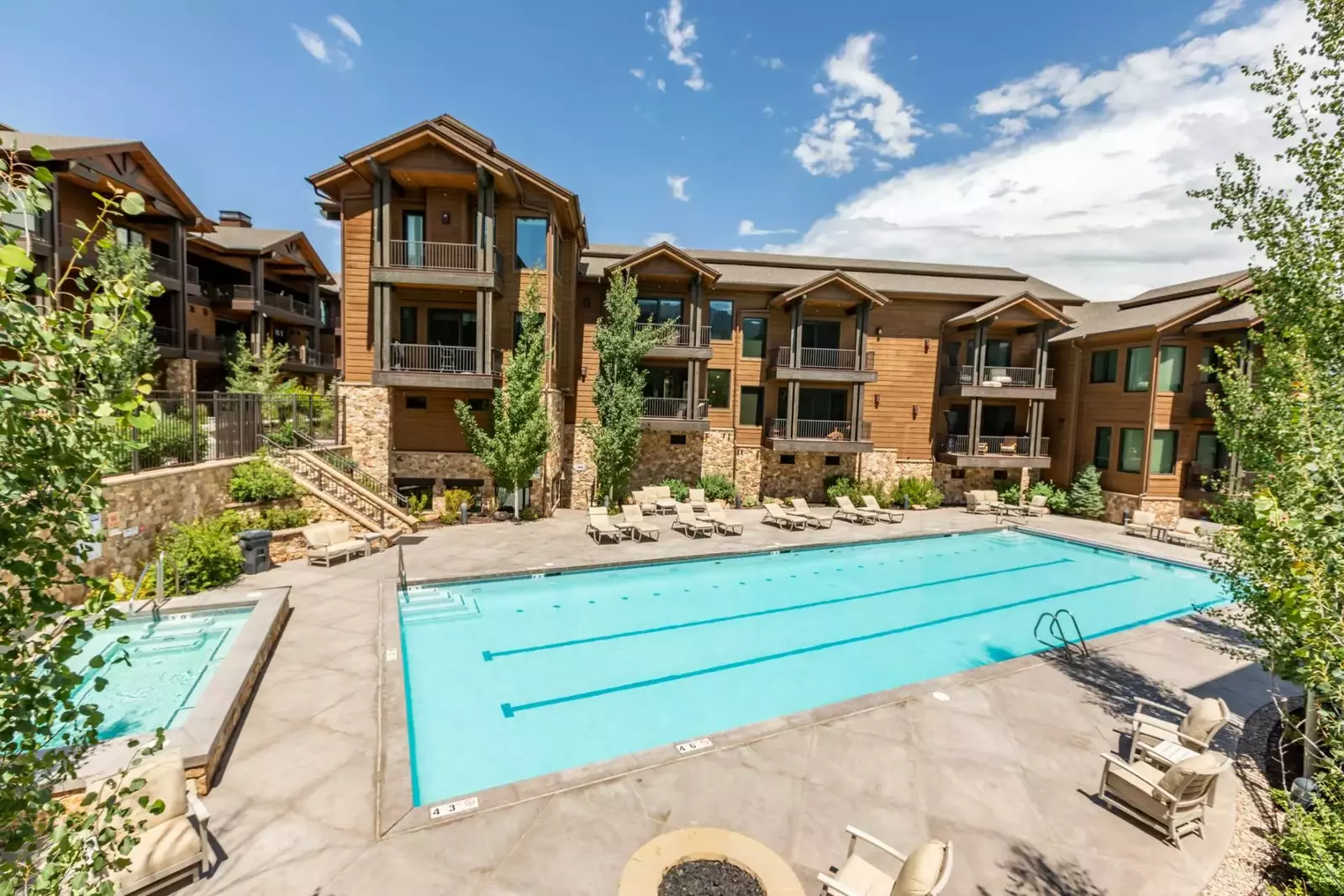 This spacious outdoor hot tub is steps away from the front door of this home and located beside the Olympic sized pool
