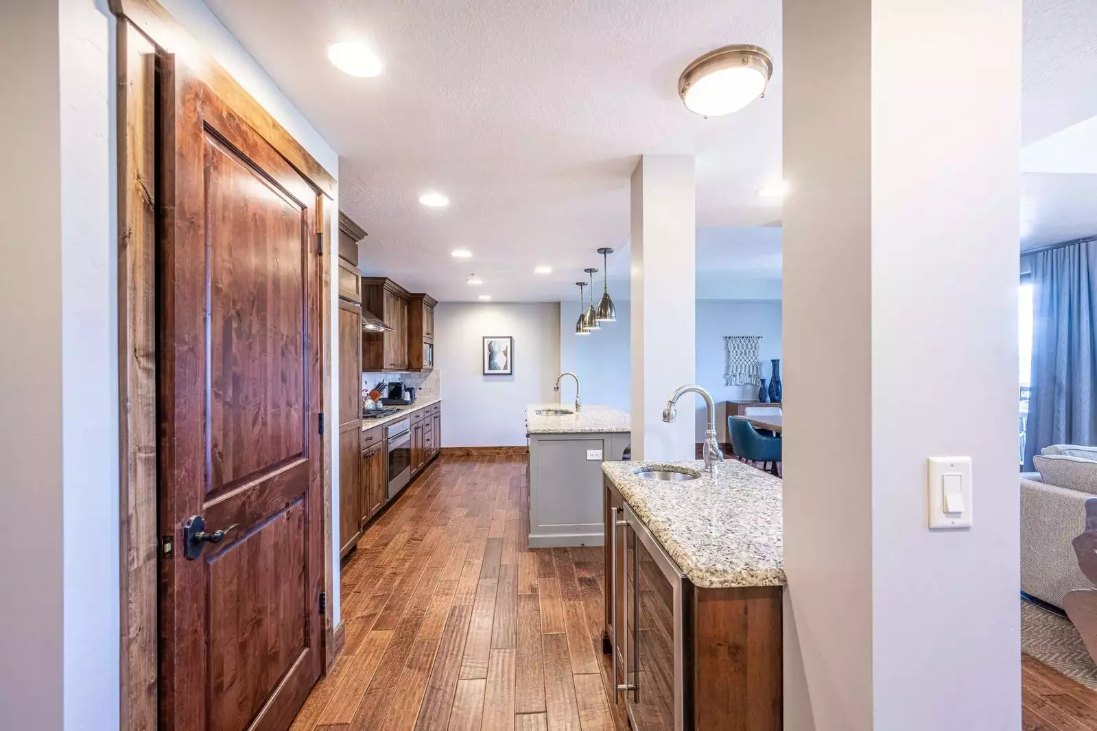 Boasting a spacious open floor plan that flows seamlessly from gourmet kitchen